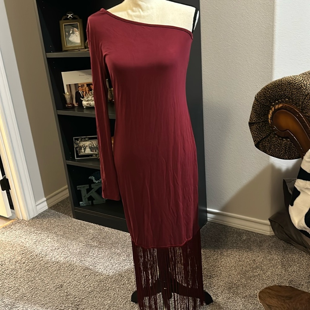 Maroon one shoulder stretch dress with fringe.